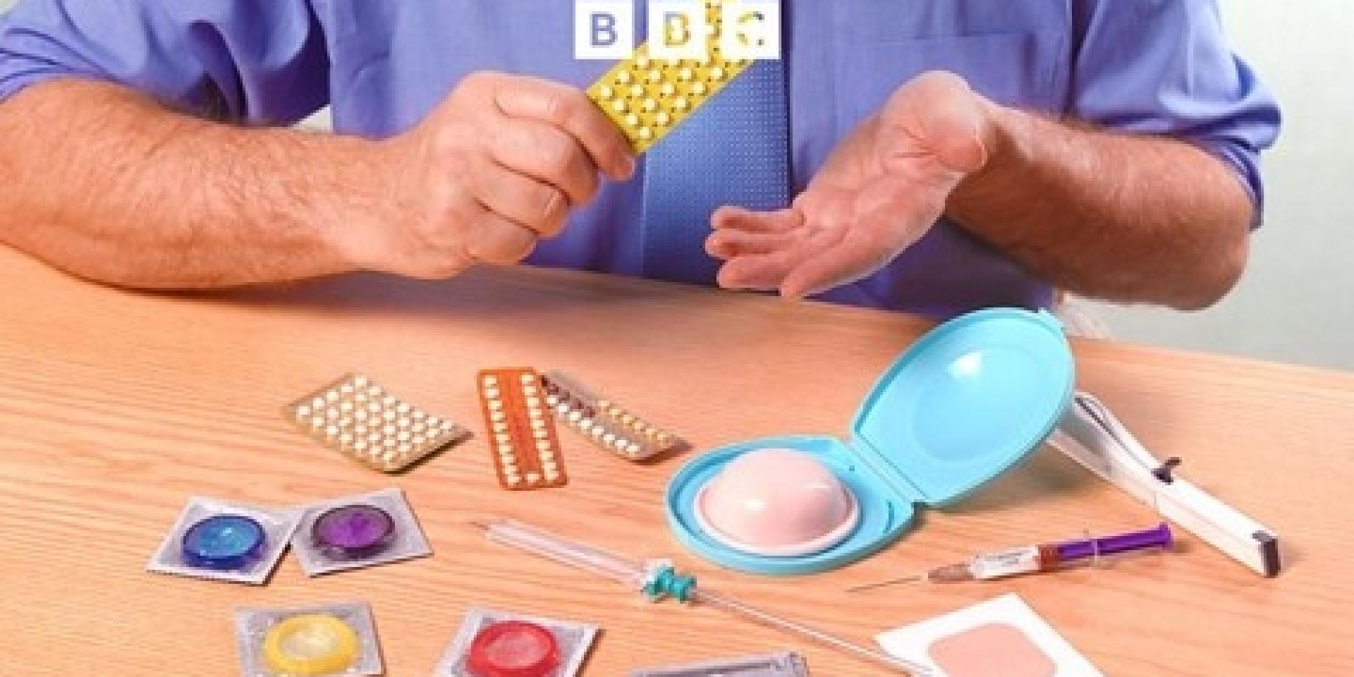 Man sitting in front a table with a variety of different contraceptive methods