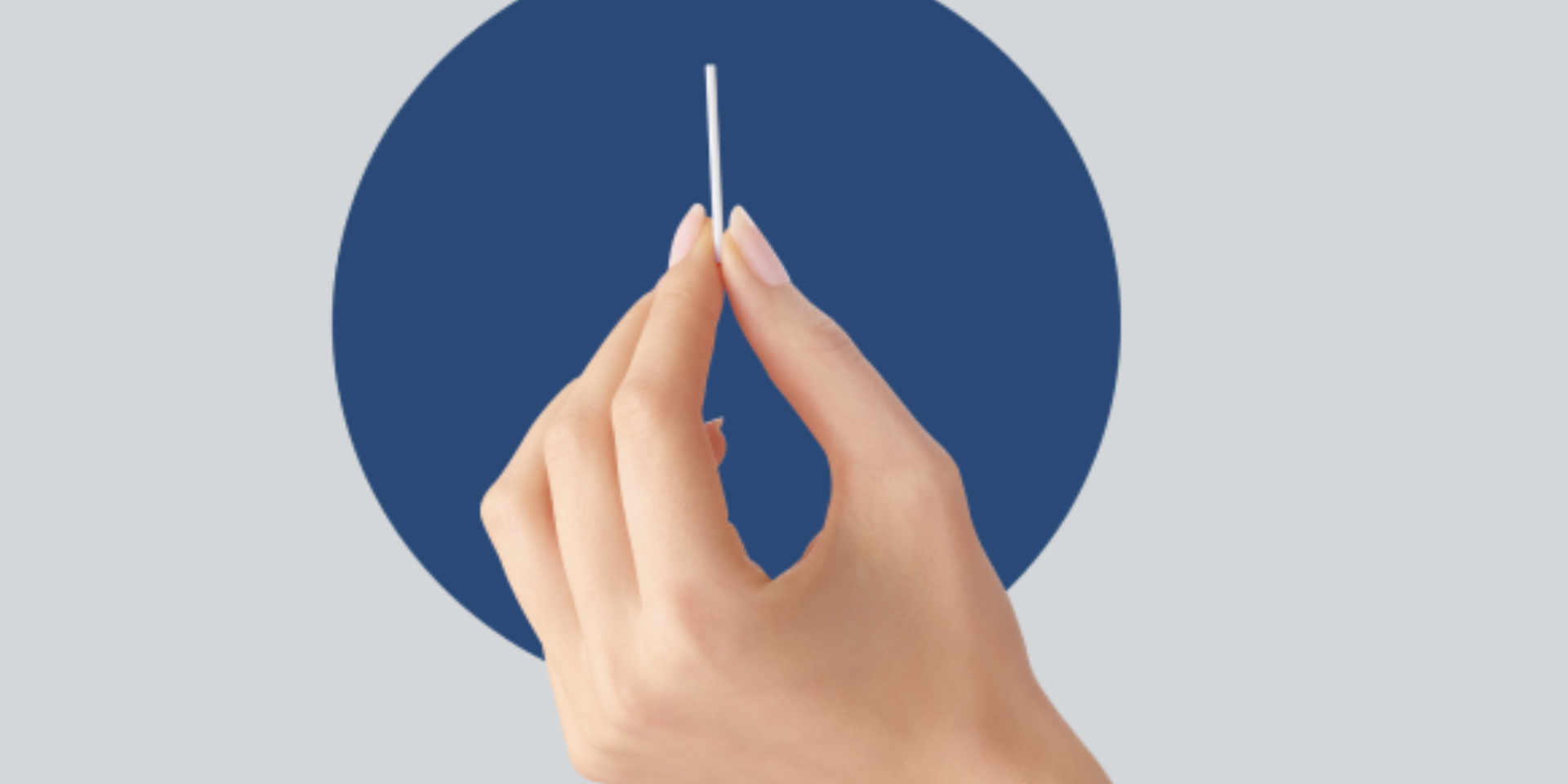Hand holding an implant rod with blue circle behind