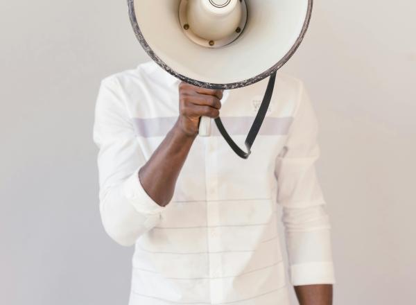 Person holds megaphone