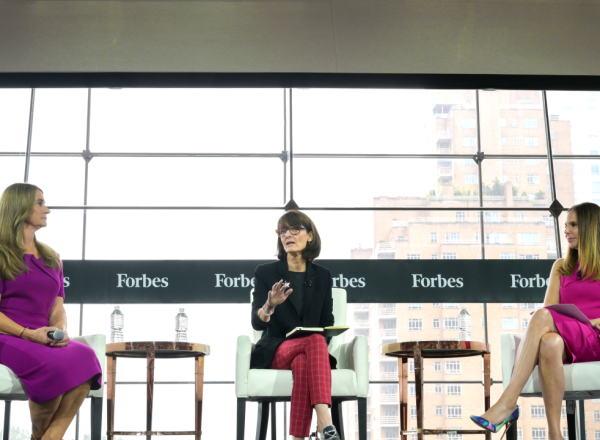 Three women, including Melinda Gates, sitting and having a discussion with 
