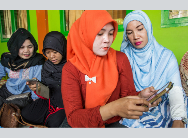 Parents using smartphones to look at contraceptive information